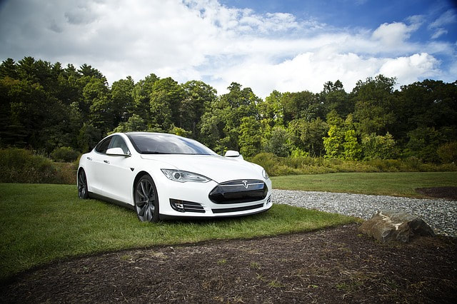 White Tesla Electric Car Requires Professional Auto Repairs and Maintenance